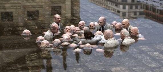 Politicians-discussing-global-warming.-Sculpture-by-Issac-Cordal.
